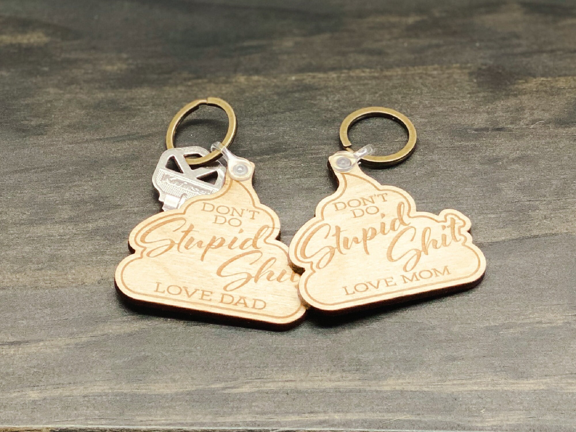 https://graceandelm.com/wp-content/uploads/2022/12/dont-do-stupid-shit-keychain-laser-engraved-key-fob-wood-keychain-poop-keychain-graduation-gift-funny-gift-63ac58aa.jpg